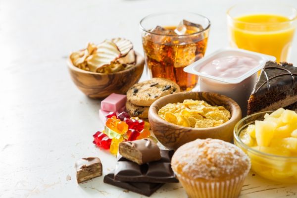 Selection of food high in sugar, copy space